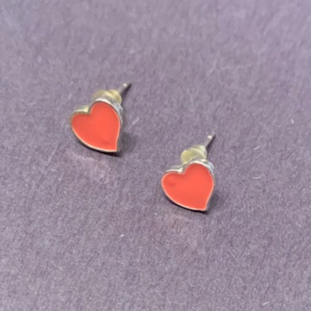 Cute small heart stud earrings with pink peach color. Like new.